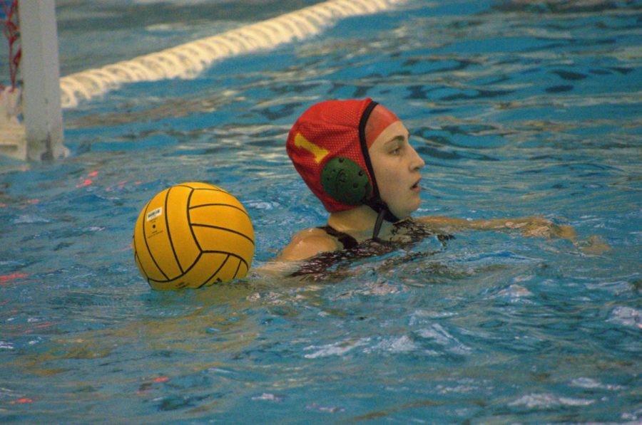 Junior+goalie+Lauren+Deighan+prepares+to+resume+play+after+a+block+against+a+Mason+player+on+April+11.+%E2%80%9CI+blocked+a+penalty+shot+5+meters.+That+was+my+first+5-meter+block%2C%E2%80%9D+Deighan+said.%E2%80%9D