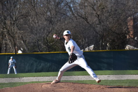 Senior pitcher and middle infielder Joey Beatty winds up and launches a pitch in the sixth inning of the first game of the doubleheader on April 21. “Seaholm week is always one of the most important weeks of the year. When we get on the field its cutthroat, no mercy,” Beatty said.