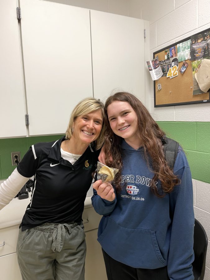Junior, Cira Racco, grabbing a cookie from Kelly on Cookie Tuesday before going to basketball practice.