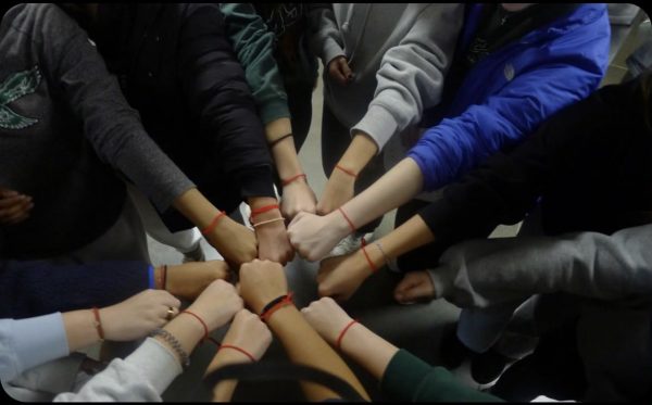 Students hands during an activity during the retreat. 