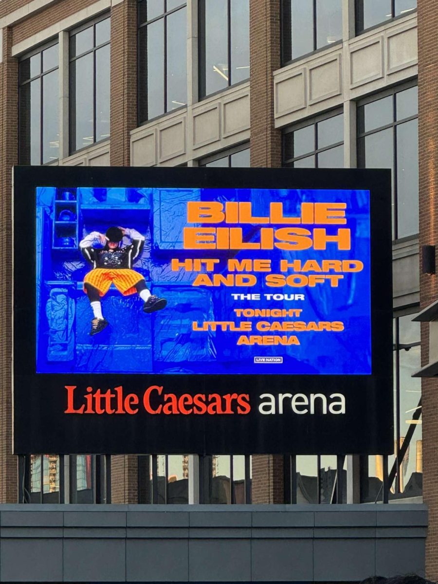 HIT ME HARD AND SOFT The Tour poster outside of Little Caesars Arena