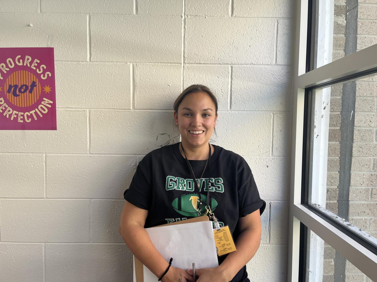 Emily Henderlong smiles in her new classroom, looking forward to the upcoming school year and making a difference