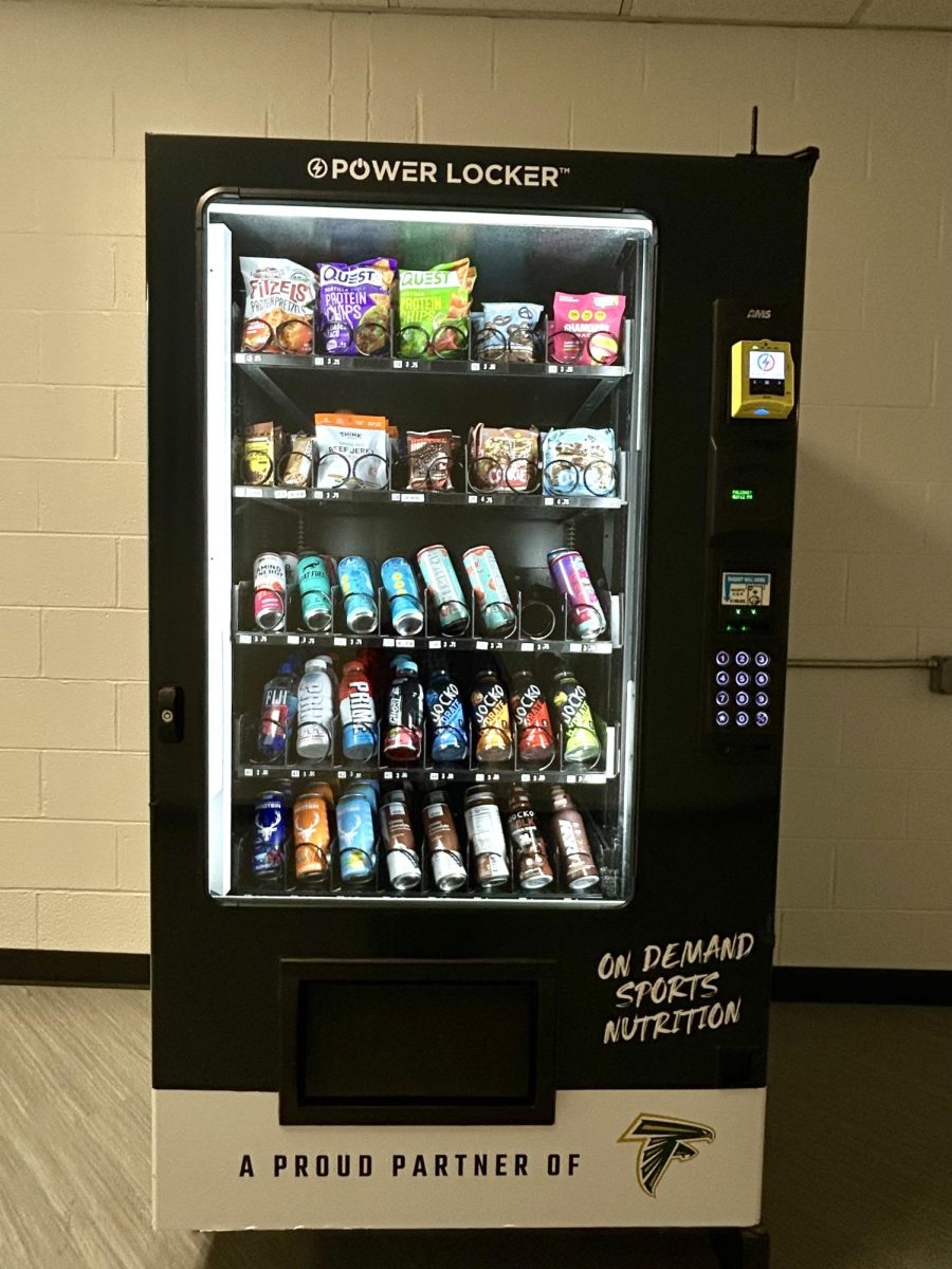 New vending machine filled to the brim with protein bars, energy drinks and a variety of other nutritious snacks.