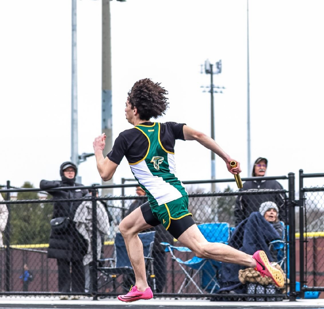 Last year's senior Lucas Hagerty running a relay race.
