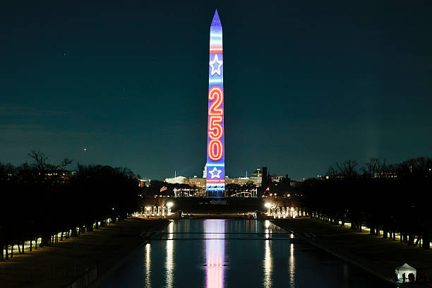 WASHINGTON, DC – DECEMBER 31: The Washington Monument is illuminated with Freedom 250 projections on December 31, 2025, in Washington, DC. As part of a New Year’s Eve celebration, each side of the monument features storytelling projections throughout the evening to kick off the United States’ 250th anniversary in 2026. (Photo by Heather Diehl/Getty Images)